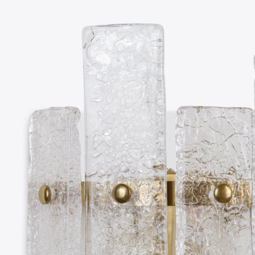 Close-up detail of crackled glass and brass fittings on the Pure White Lines Tahli wall light.