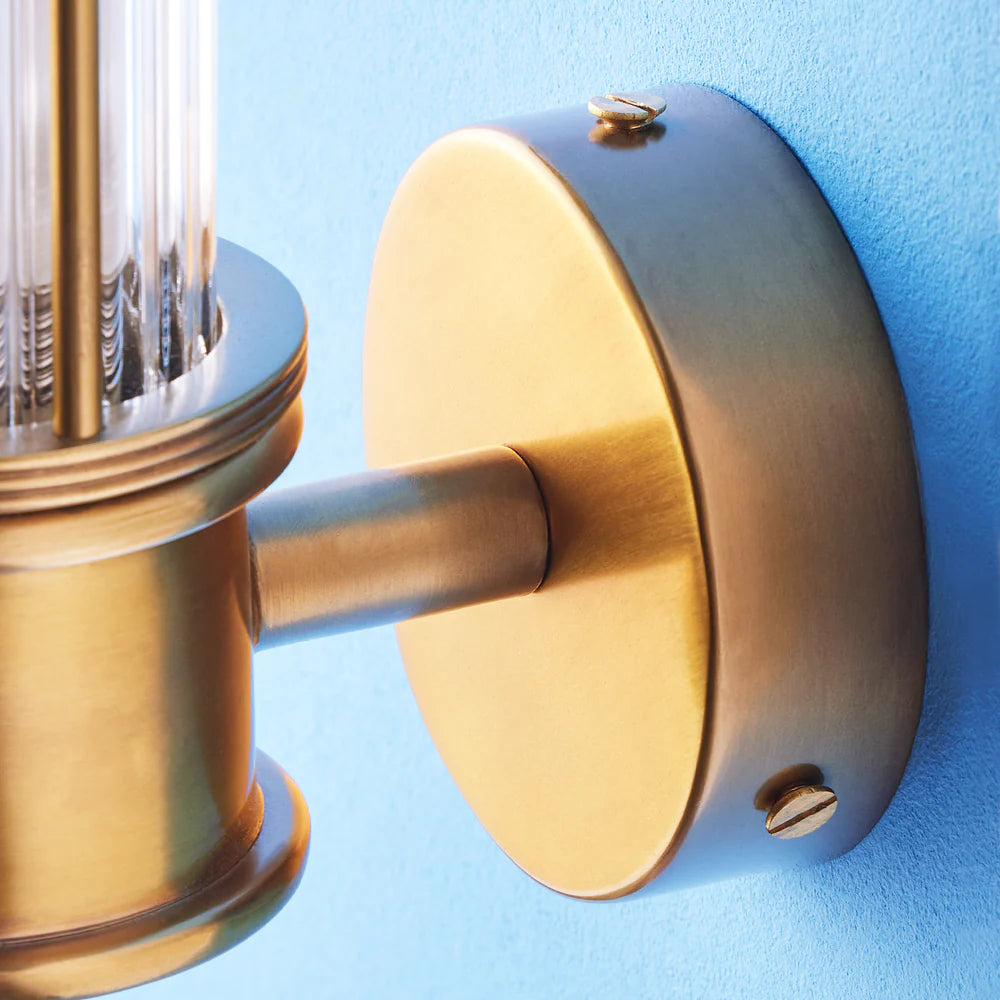 Pooky Hunter IP44 wall light in brass and glass