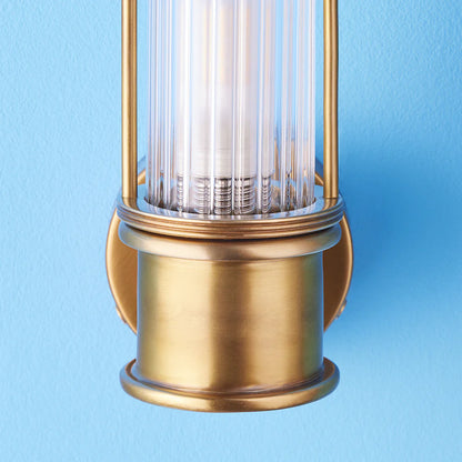 Pooky Hunter IP44 wall light in brass and glass