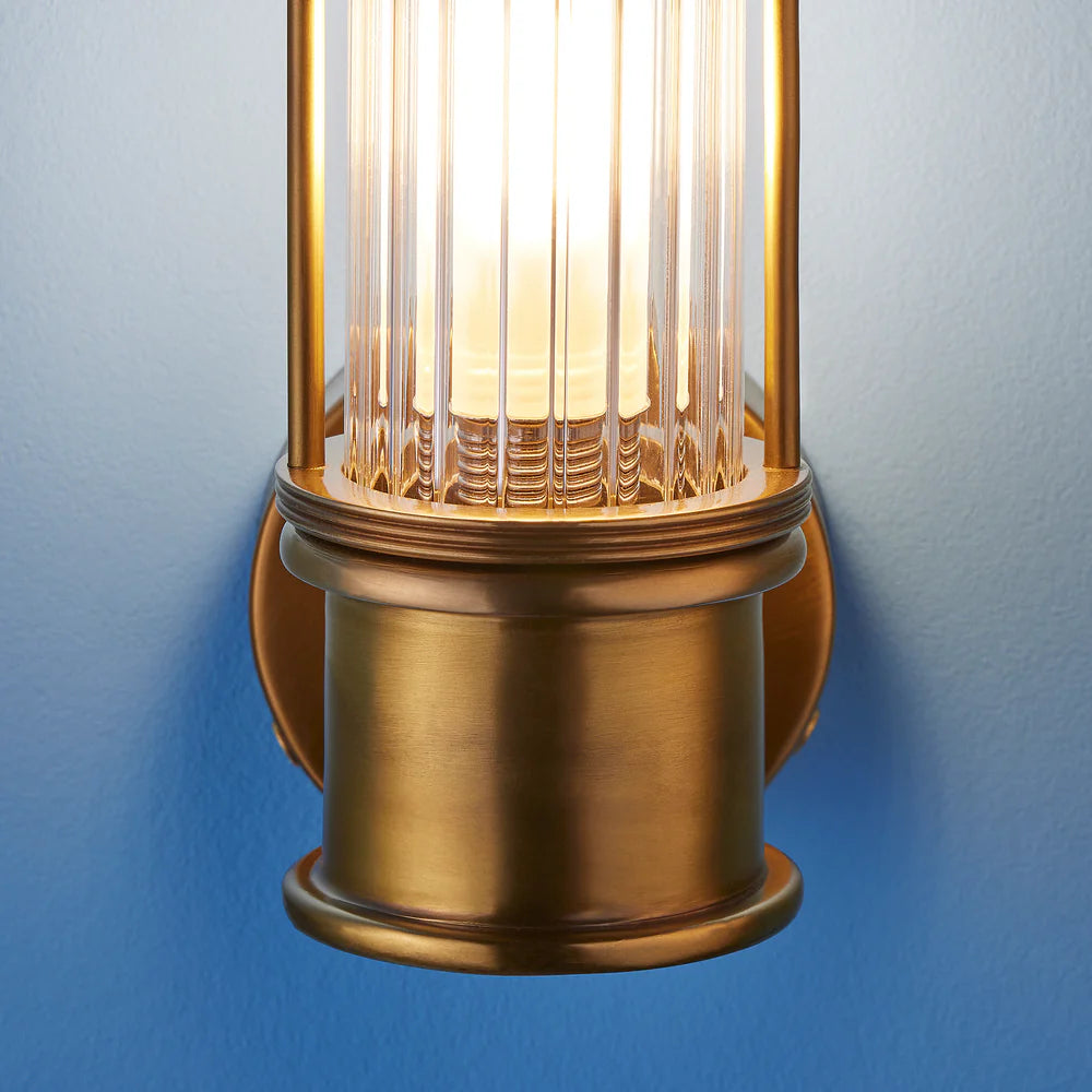 Pooky Hunter IP44 wall light in brass and glass