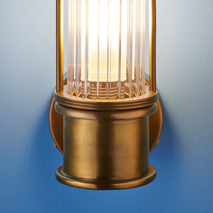 Pooky Hunter IP44 wall light in brass and glass