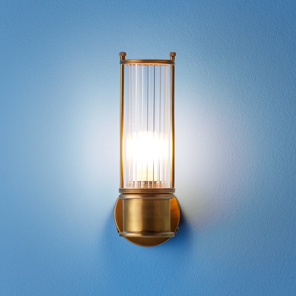 Pooky Hunter IP44 wall light in brass and glass