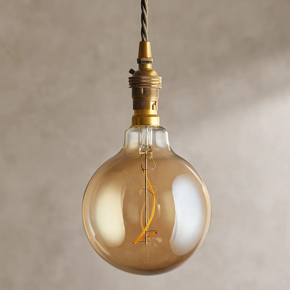 Pooky Extra Large Globe 4 Watt Irregular Filament LED Bulb with Amber Coating and B22 Fitting